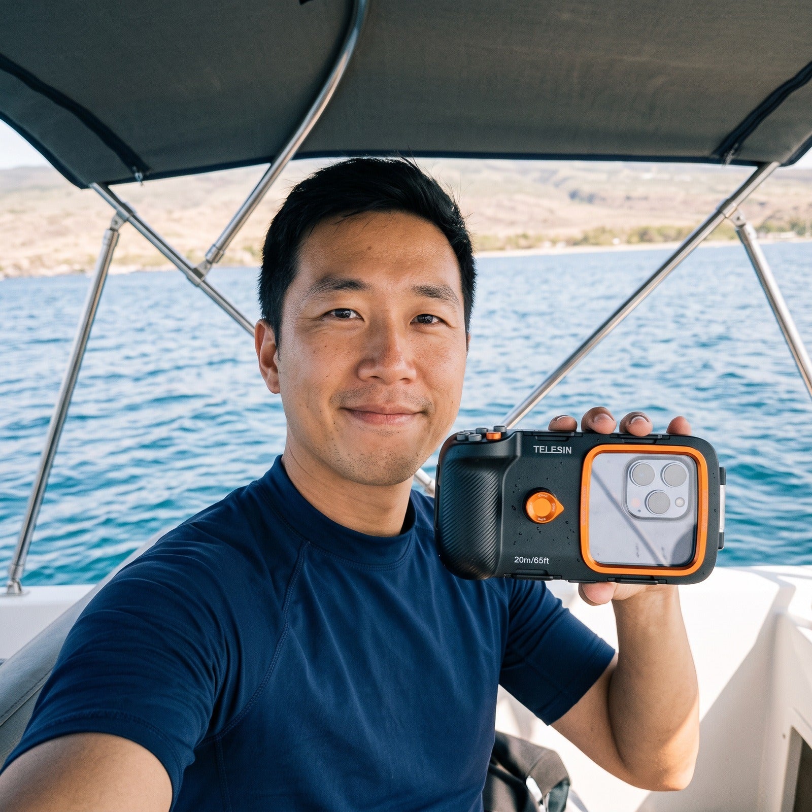 East Asian man taking a boat selfie with Tideglass